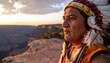 © Benxiumo - Native American at Sunset: A contemplative Native American man in traditional headdress gazes across the vast expanse of the Grand Canyon at sunset. The image evokes a sense of history, heritage.