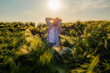 © DusanJelicic - Worried farmer is kneeling in his fallen barley field at sunset, holding his head in his hands, expressing despair and frustration over the damaged crops