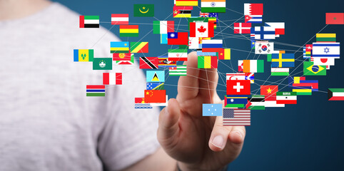 Leinwandbilder - A hand interacts with a network of flags, representing global connections and international relations.