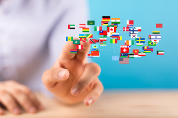 Fototapete - Image of a hand interacting with a network of interconnected world flags, symbolizing global connectivity and international relations.