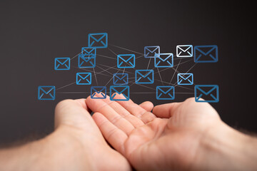 Fototapete - Image of interconnected email icons above hands, symbolizing global communication and networking.