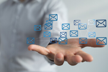 Fototapete - Person holding interconnected email icons,digital communication, networking concept.