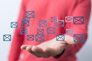 Poster - Hand holding network of email icons.  Digital communication, global connection, and networking concept.