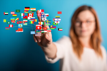 Leinwandbilder - Image of a woman connecting with a global network of flags, representing international business or communication.