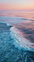 Wall Mural - Serene Ocean Waves at Sunset with Soft Pink and Blue Tones Creating a Tranquil Coastal Atmosphere and Gentle Movement Across the Water Surface