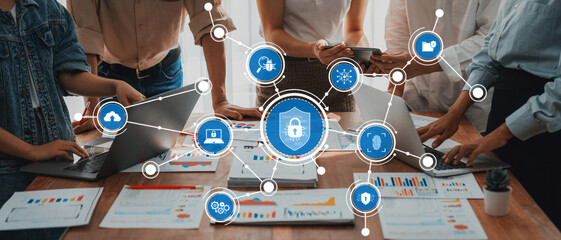Fototapete - A dynamic team engages in discussions around security solutions, utilizing laptops and data charts to drive innovation and collaboration in a modern office environment. Amity