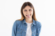 © Яна Солодкая - Photo of cheerful funny girl rolled tongue make eyes look at each other isolated white color background