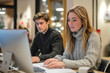 © Color Forge - Man and woman working on computer in office