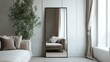 © thenort - Full-length mirror reflecting a living room with a sofa, plant, and curtains.