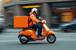 © Vadym - Delivery man with orange moped drives fast on city street. Courier with rectangular delivery backpack on scooter. Transportation, service, food order, express delivery, online shopping, packages.