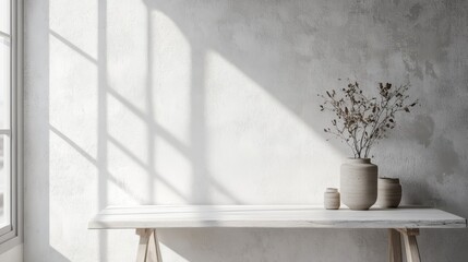 Poster - Minimalist interior design sunlight illuminates a white table with dried flowers in a vase against a textured wall.