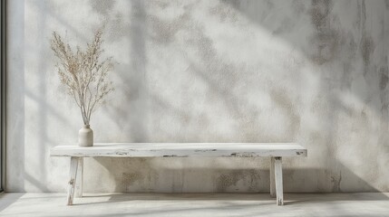 Poster - White rustic bench against a textured wall with dried flowers in a vase.