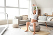 © Pixel-Shot - Sporty pregnant woman training on fitball at home