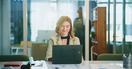 Fototapete - Laptop, typing and business woman in office to check email, profit or investment banking. Computer, happy worker and reading report online for financial news, economy update or coworking on internet