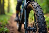 Close-up of rugged mountain bike tires with aggressive tread pattern, ready for off-road adventure , detail, nature
