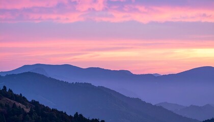 Wall Mural - the sun rises over misty hills and valleys.