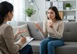 © Vooglo.com - Young woman in therapy session discussing her problems with a therapist in a clinic