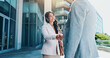 © peopleimages.com - Business people, meeting and city with handshake for partnership, B2B or corporate deal. Employees, colleagues or shaking hands with smile for greeting, introduction or agreement in an urban town