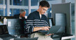 © peopleimages.com - Man, programmer and office with laptop for coding, software development or app design. Male person, coder or developer with computer or technology for cybersecurity, web or IT services at workplace