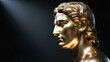 © claudunia - A golden statue bust seen in profile The classical figure has wavy hair and smooth features