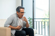 © Chanakon - Old man senior have throat irritation mucus and coughing. Fever headache respiratory tract infection. Mature man unhealthy Sickness need to consult a doctor and get treatment.