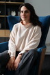 © Andrii Zastrozhnov - Young caucasian female relaxing in modern office setting