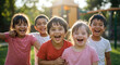 © NN AI - Diverse group of children laughing together outdoors in sunlight. Kids with Down syndrome and different ethnicities enjoying playground. Inclusion concept. Friendship without boundaries. Childhood joy