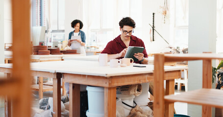 Poster - Man, tablet and typing at pottery workshop with update for web store with sculpture, tea cup and review at studio. Person, digital touchscreen and manager with app for ceramic product with inventory