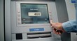 © Framestock - Cash Machine: Unrecognizable Man Entering PIN Code on Keypad, Choosing Withdrawal Money Operation, Entering Amount and Taking US Dollars from ATM Machine. Banking System and Transactions. Close Up.