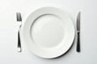 © Mariya - Clean, empty dinner plate on white background, overhead, dining, white
