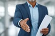 © Graini - Businessman offering handshake partnership deal success professional career job opportunity meeting