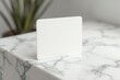 © Alvin - Blank-white-business-card-marble-background-mockup-branding-template-design