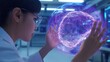 © Korawan - A woman wearing a lab coat is holding a glowing brain in her hands