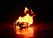© lisica1 - burning balls with chains for a fire show lie on the floor