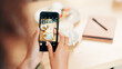 © peopleimages.com - Phone screen, hands and photography of breakfast, cafe or recommendation for restaurant on website. Coffee shop, influencer and person with mobile for picture, above or review of food on social media