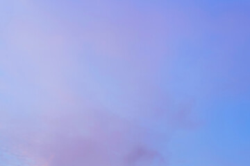 Wall Mural - Twilight sky with effect of light in pastel pink, coral, orange, blue tones. Colorful sunset of soft clouds. Background