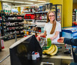 © Jelena - Friendly checkout experience at a vibrant grocery store