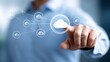 © watcharee - A person interacts with a digital cloud network interface, symbolizing cloud computing and data connectivity.