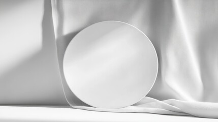 Poster - Empty white plate on white fabric background, minimalist style.