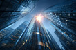 © mcjanuald - Low angle view of modern glass skyscrapers with a bright sun flare