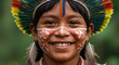 © Tgad - Portrait of a smiling indigenous boy with face paint and feather headdress in a natural setting Amazon Brazil Amazon Brazil