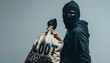 © Luxetify - Person in Black Balaclava and Hoodie Holding a Loot Bag on Gray Background