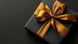 © Nasyih - Elegant black gift box with gold ribbon (1)