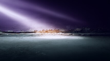 Aufkleber - Light streams through a narrow gap in a weathered wall, illuminating the floor as orange and purple hues blend with a darkening sky, creating a captivating atmosphere