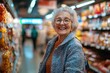 © Iftikhar alam - Elderly woman enjoys shopping in a bustling city store filled with colorful products, Elderly woman smiling while shopping in a city store