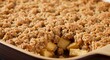 © AleniaFlow - Golden Brown Apple Crumble Dessert in a Baking Dish