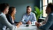 © Zaahid - A diverse group of professionals engaged in a business meeting around a conference table, discussing ideas with focus and collaboration