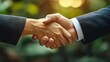 © Aisha - Elegant female manager and male professional shaking hands after meeting, modern interior