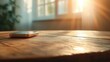 © Yopi - Mobile Phone on Wooden Table in Sunlight