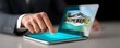 © Achirawee - Amidst the hustle of a bustling office, a real estate agent engages with holographic 3D render models, showcasing the potential of futuristic property developments. The blurred background adds a
